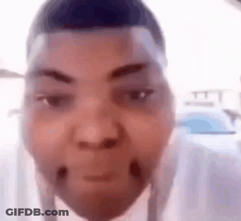 A Close Up Of A Person 'S Face With A Very Funny Face . GIF