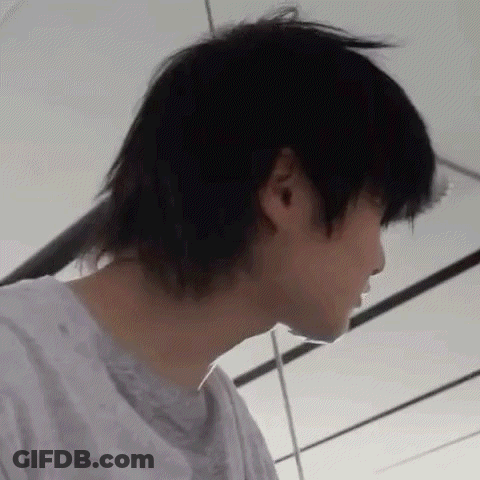 A Close Up Of A Person 'S Face With A Very Long Black Haircut . GIF