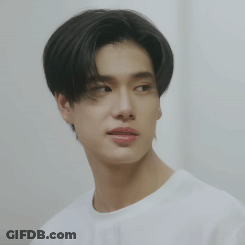 A Close Up Of A Person 'S Face With A White Shirt GIF