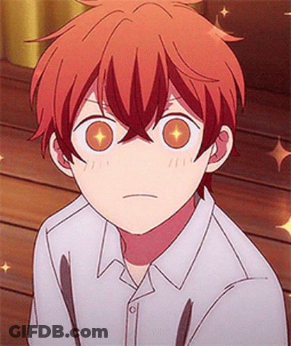A Close Up Of A Person 'S Face With A White Shirt And Red Hair GIF