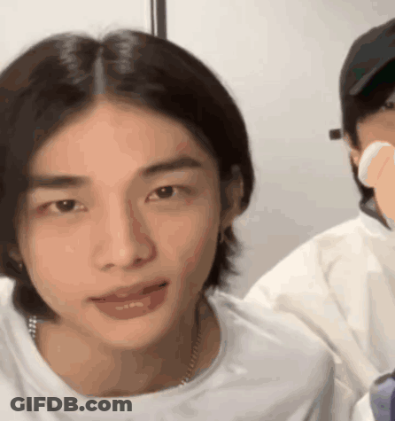 A Close Up Of A Person 'S Face With A White Shirt On GIF