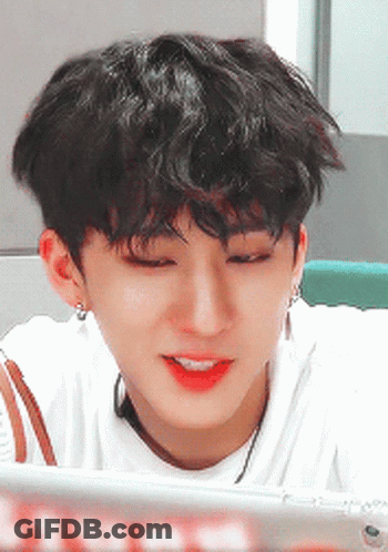 A Close Up Of A Person 'S Face With A White Shirt On GIF
