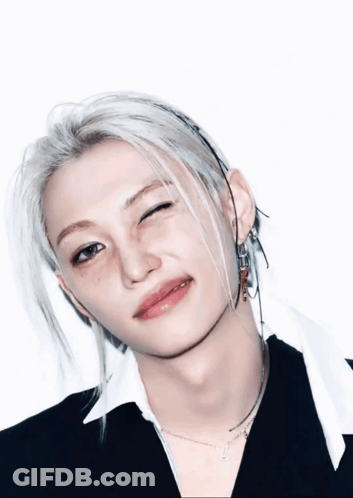 A Close Up Of A Person 'S Face With A Wink On Their Face GIF