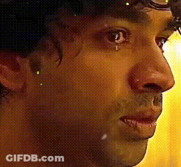 A Close Up Of A Person 'S Face With A Yellow Background GIF