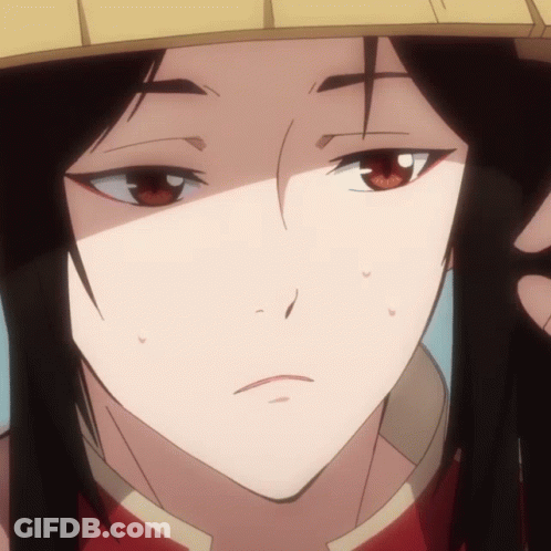 A Close Up Of A Person 'S Face With A Yellow Hat On GIF