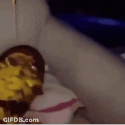 A Close Up Of A Person 'S Face With A Yellow Sauce On It GIF
