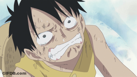 A Close Up Of A Person 'S Face With A Yellow Shirt On GIF