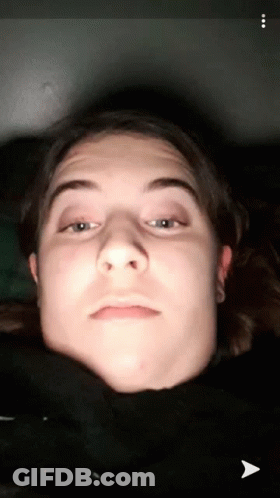 A Close Up Of A Person 'S Face With An Arrow Pointing To The Bottom Left GIF