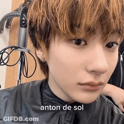 Close Up Of Person's Face With Anton De Sol Text GIF