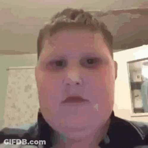 A Close Up Of A Person 'S Face With Black Eyes And A Purple Background . GIF