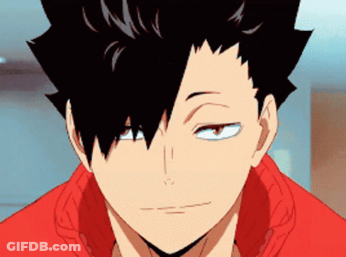 A Close Up Of A Person 'S Face With Black Hair And A Red Shirt . GIF