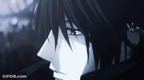 A Close Up Of A Person 'S Face With Black Hair And Blue Eyes GIF