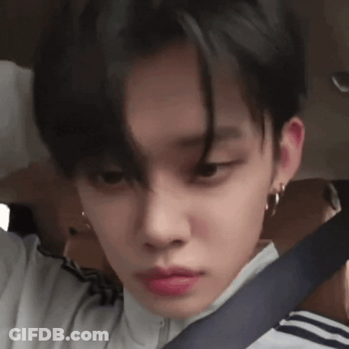 A Close Up Of A Person 'S Face With Black Hair And Red Lipstick GIF