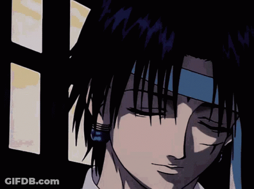 A Close Up Of A Person 'S Face With Blue Earrings On GIF