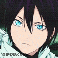 A Close Up Of A Person 'S Face With Blue Eyes And Black Hair GIF