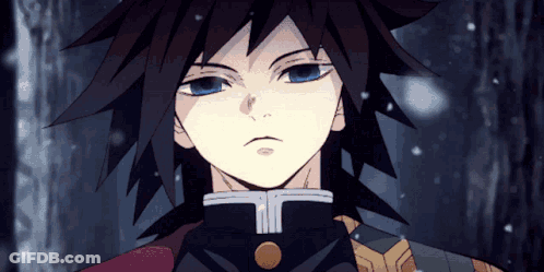 A Close Up Of A Person 'S Face With Blue Eyes And Black Hair GIF