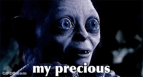 A Close Up Of A Person 'S Face With Blue Eyes And The Words `` My Precious '' Written On It . GIF