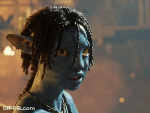 A Close Up Of A Person 'S Face With Blue Paint On It GIF