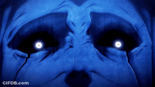 A Close Up Of A Person 'S Face With Bright Blue Eyes GIF