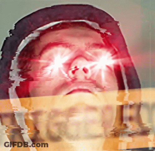 A Close Up Of A Person 'S Face With Bright Red Eyes GIF