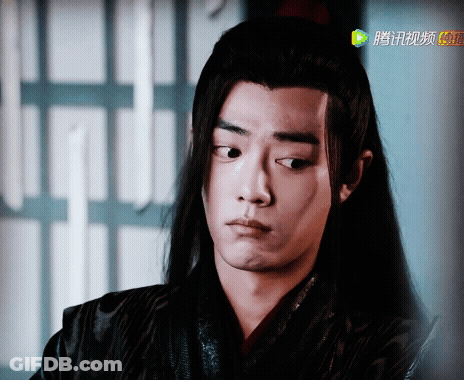 A Close Up Of A Person 'S Face With Chinese Writing On The Bottom Right GIF