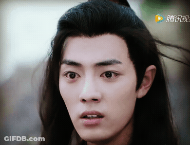 A Close Up Of A Person 'S Face With Chinese Writing On The Bottom Right GIF