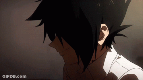 A Close Up Of A Person 'S Face With Dark Hair And A White Shirt GIF