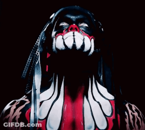 A Close Up Of A Person 'S Face With Dreadlocks And Red And White Paint GIF