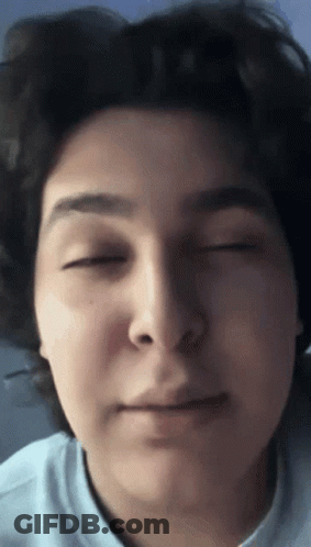 A Close Up Of A Person 'S Face With Eyes Closed GIF
