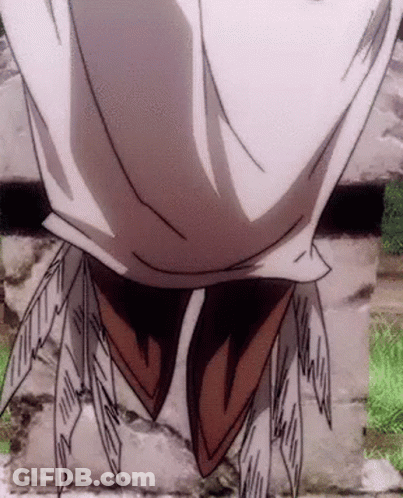 A Close Up Of A Person 'S Face With Feathers Coming Out Of It . GIF