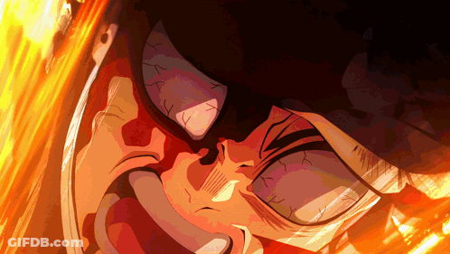 A Close Up Of A Person 'S Face With Flames Behind Him GIF