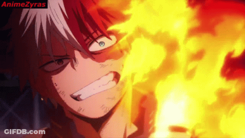 A Close Up Of A Person 'S Face With Flames Coming Out Of It GIF