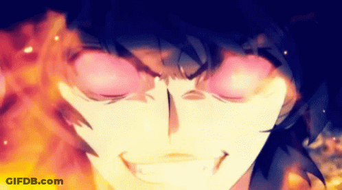 A Close Up Of A Person 'S Face With Flames Coming Out Of It 'S Eyes GIF