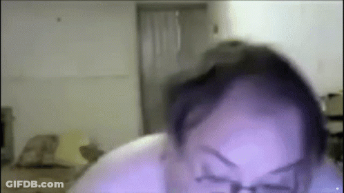 A Close Up Of A Person 'S Face With Glasses On . GIF
