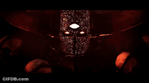 A Close Up Of A Person 'S Face With Glowing Eyes GIF