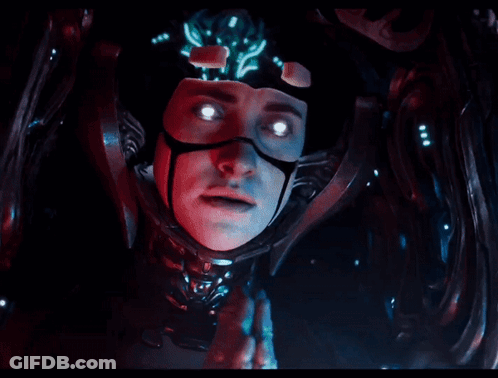 A Close Up Of A Person 'S Face With Glowing Eyes In A Dark Room GIF