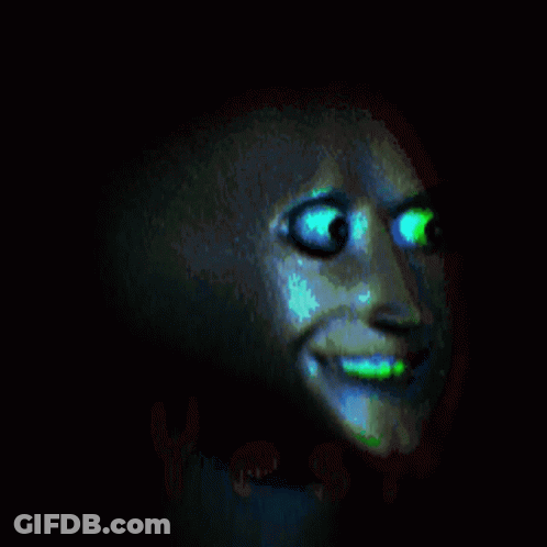 A Close Up Of A Person 'S Face With Glowing Eyes In The Dark GIF