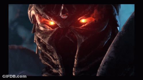 A Close Up Of A Person 'S Face With Glowing Eyes GIF