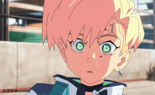 A Close Up Of A Person 'S Face With Green Eyes GIF