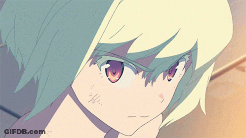A Close Up Of A Person 'S Face With Green Hair GIF