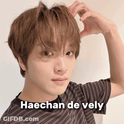 A Close Up Of A Person 'S Face With Haechan De Vely Written On The Bottom GIF