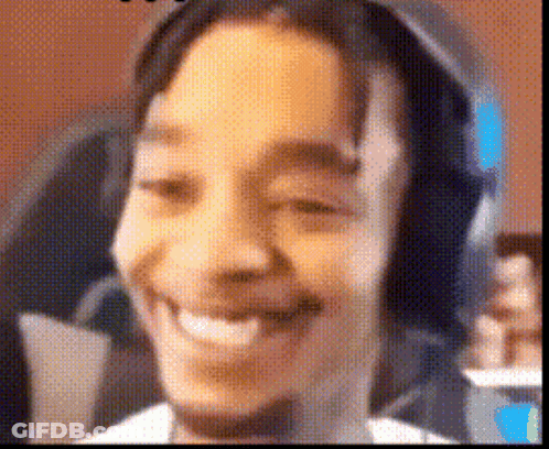 A Close Up Of A Person 'S Face With Headphones On . GIF