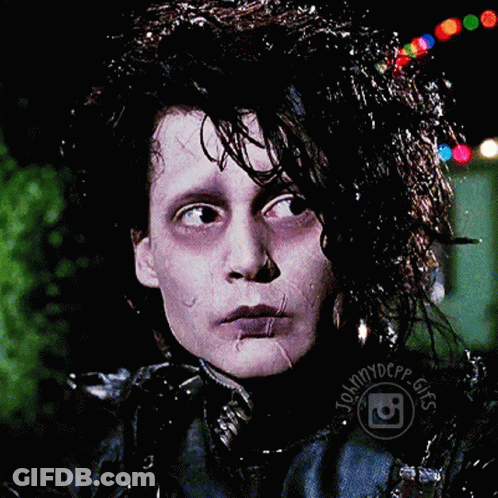 A Close Up Of A Person 'S Face With Johnnydepp Gifs Written Around His Neck GIF