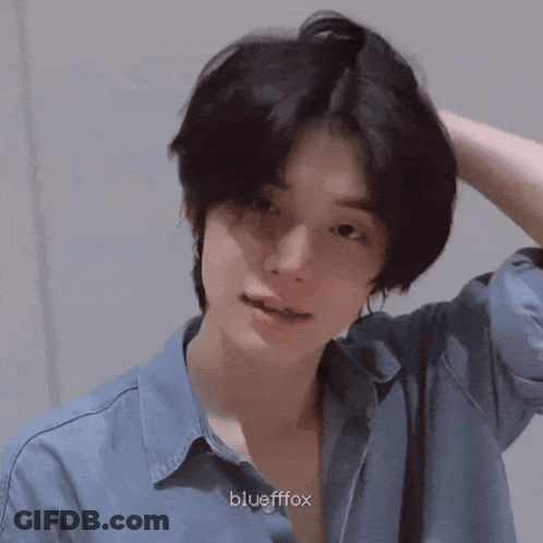 A Close Up Of A Person 'S Face With Korean Writing GIF