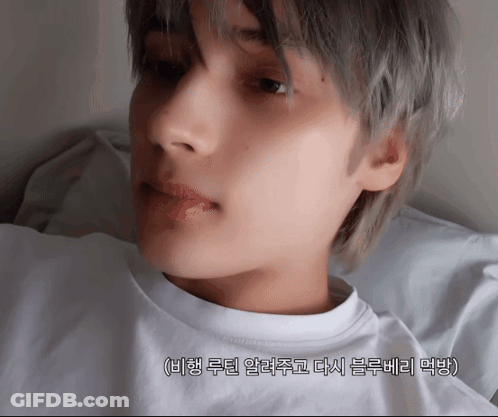 A Close Up Of A Person 'S Face With Korean Writing On The Bottom Right GIF