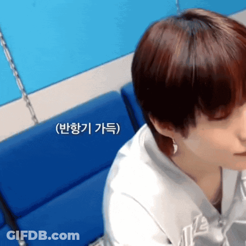 Close Up Of Person's Face With Korean Writing GIF