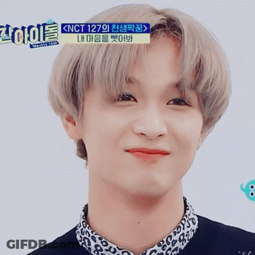 A Close Up Of A Person 'S Face With Korean Writing On The Top GIF