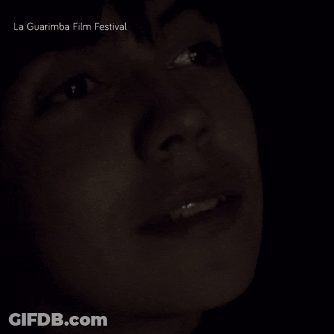 A Close Up Of A Person 'S Face With La Guarimba Film Festival Written Above GIF
