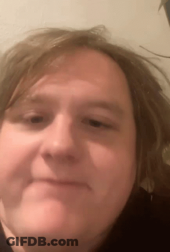 A Close Up Of A Person 'S Face With Long Hair GIF