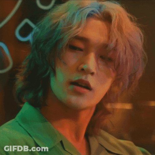 A Close Up Of A Person 'S Face With Long Hair GIF
